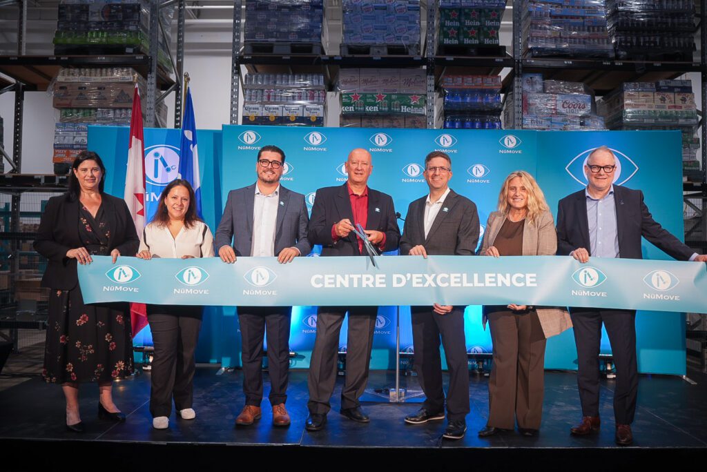 local elected officials and NūMove associates cutting the ribbon during the grand opening ceremony of the Center of Excellence